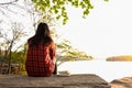 Relaxing moments, Young woman reading a book in nature background. Solo relaxation, color of Hipster Tone. Royalty Free Stock Photo