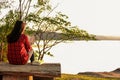 Relaxing moments, Young woman reading a book in nature background. Solo relaxation, color of Hipster Tone. Royalty Free Stock Photo