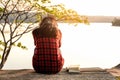 Relaxing moments, Young woman reading a book in nature background. Solo relaxation, color of Hipster Tone. Royalty Free Stock Photo