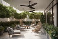 relaxing outdoor seating space with contemporary lounge chairs, potted plants and overhead fan