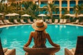 Relaxing by the Pool: Female Vacationer Enjoys Sunny Day