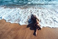 Relaxing on sand by the sea wave, summer beach concept. Royalty Free Stock Photo