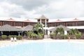 Relaxing scenery at resort in Guadeloupe. Tropical scene with beach chairs and palm trees