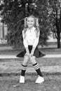 Relaxing in school yard. Perfect schoolgirl relaxing between classes. Life balance. Student adorable child in formal