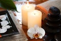 Relaxing spa with candles orchids towels Royalty Free Stock Photo