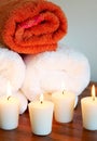 Relaxing spa scene with rolled up towels