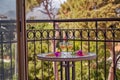 Relaxing summer cocktails and surreal flowers of bougainvillea in front of Turkey flag, mountains and trees. Travel