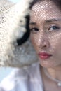 Woman wearing her straw hat and let the Sunlight passing through.