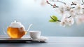 Relaxing tea setup with cherry blossoms in a tranquil setting Royalty Free Stock Photo