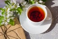 Relaxing time and happiness with cup of tea with among fresh spring flower. Royalty Free Stock Photo