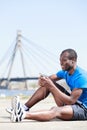 Relaxing after training. Young african men sitting outdoors with Royalty Free Stock Photo