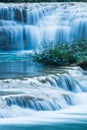 Relaxing by tropical waterfall in the morning Royalty Free Stock Photo