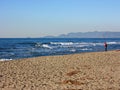 Relaxing walks on the sandy beach of Versilia on a sunny day in Italian winter