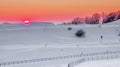 Relaxing warm sunset in a snowy landscape