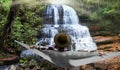 Man relaxing by a waterfall Royalty Free Stock Photo