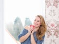 Relaxing by window with a cup of tea Royalty Free Stock Photo