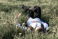 Relaxing woman lying on spring blooming meadow. Girl resting in spring park. Royalty Free Stock Photo