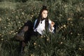 Relaxing woman lying on spring blooming meadow. Girl resting in spring park. Royalty Free Stock Photo