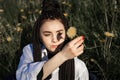 Relaxing woman lying on spring blooming meadow. Girl resting in spring park. Enjoy life, Royalty Free Stock Photo