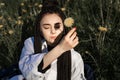 Relaxing woman lying on spring blooming meadow. Girl resting in spring park. Enjoy life Royalty Free Stock Photo