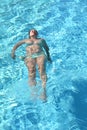 Relaxing woman in swimming pool Royalty Free Stock Photo