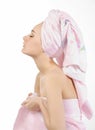 Relaxing woman with towel pink.