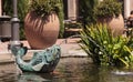 Relaxing zen fountain in a koi pond Royalty Free Stock Photo
