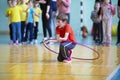 Relay race in elementary school. The boy goes in for sports. Children`s training. Sports Day