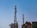 Relay tower with many antennas against the blue sky. Royalty Free Stock Photo