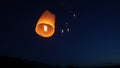 Release the traditional paper lanterns into the sky during the night of the festival in Thailand