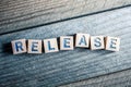 Release Written On Wooden Blocks On A Board Royalty Free Stock Photo