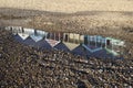 Relection of Beach Huts on Southwold Beach, Suffolk, England Royalty Free Stock Photo