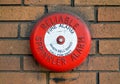 Reliable Sprinkler Fire Alarm Bell on a Brick Wall