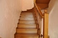 Oak staircase in the interior of the cottage`s living space.