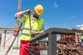 Reliable worker checking the safety latch of a hook