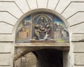 Relief of the birth of Saint Francis over the stairs leading to the hostel where he was born in Assisi, Italy. Royalty Free Stock Photo