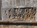 Relief carving of Vamana vishnu avatar kiling asura king Bali on the wall