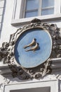 Relief on facade of old building, birds, Nerudova street, Prague, Czech Republic