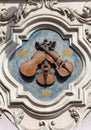 Relief on facade of old building, House Under three violins, Neruda street, Prague, Czech Republic, Europe