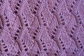Relief pattern with perforations on handmade pink knitwork