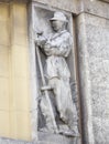 Relief of the peasant man on the old building Royalty Free Stock Photo