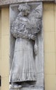 Relief of the peasant woman on the old building Royalty Free Stock Photo