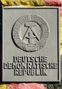 Relief with symbols of the German Democratic Republic Royalty Free Stock Photo
