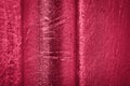 Relief wall as abstract background in metallic red viva magenta color.