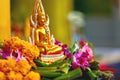 Religion. Buddha Statue With Flowers At Temple, Thailand. Buddhism. Praying.