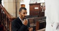 Religion, church and man with priest for communion for ceremony, service and sermon at altar. Catholic, praying and Royalty Free Stock Photo