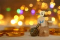 Religion concept of of jewish holiday Hanukkah with wooden dreidels spinning top and chocolate coins over wooden table and bokeh Royalty Free Stock Photo