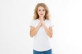 Religion concept. Praying young caucasian girl. woman in summer shirt isolated on white background. Copy space. Make a wish Royalty Free Stock Photo