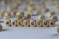 Religion - cube with letters, sign with wooden cubes Royalty Free Stock Photo