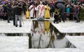 Religion, feast of the Epiphany. The priest blesses the winter the water in the river, in the hole